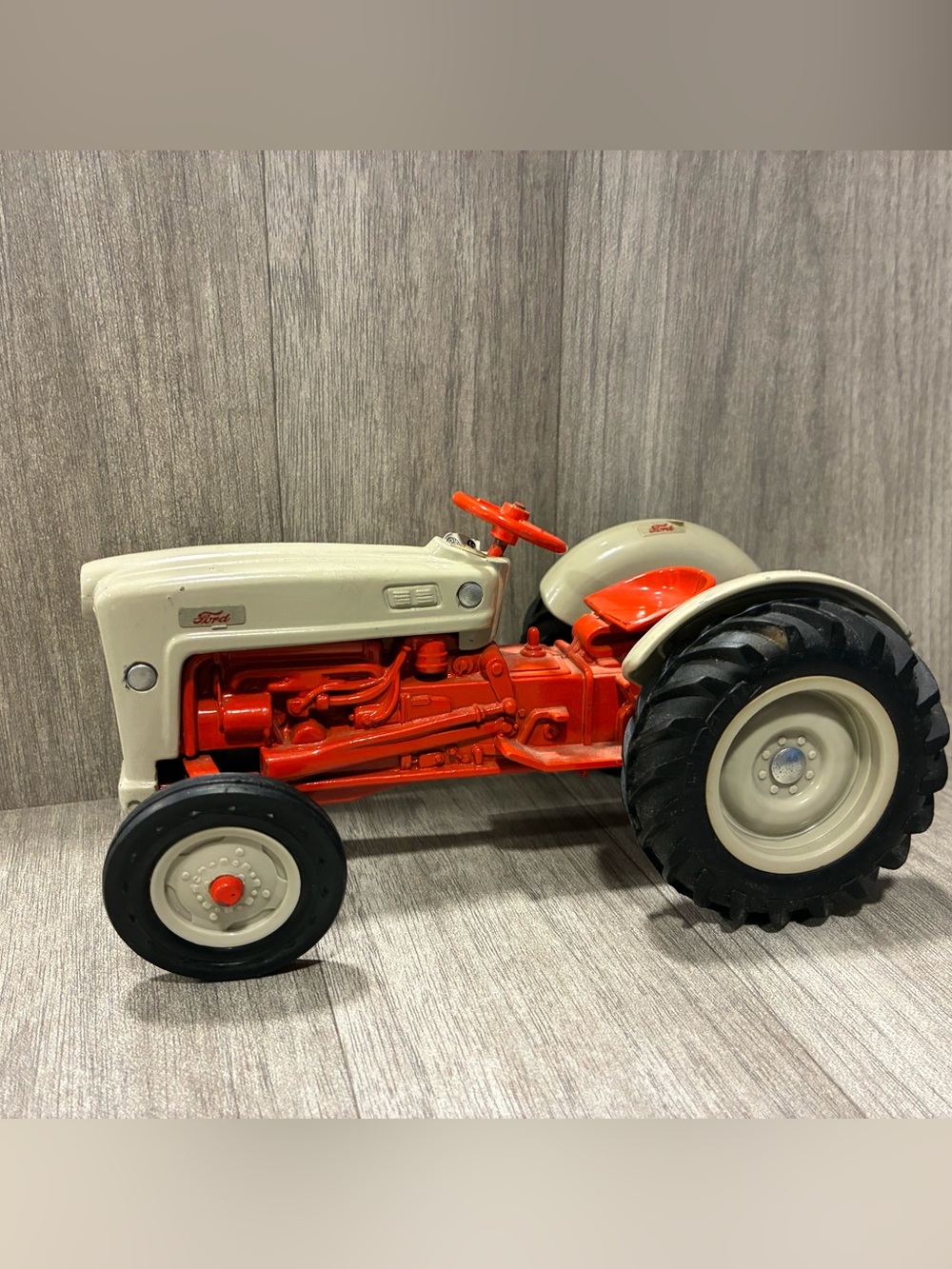 Ertl Toy Ford  Red Die Cast Tractor

- Some play wear & sticker wear 
- Has Gold